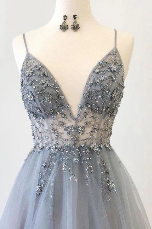 Side view of the long A-line tulle dress with V-neck and delicate appliques.