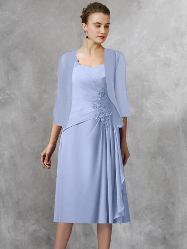 Close-up of lace appliques and side-draped detail on the chiffon tea-length dress.
