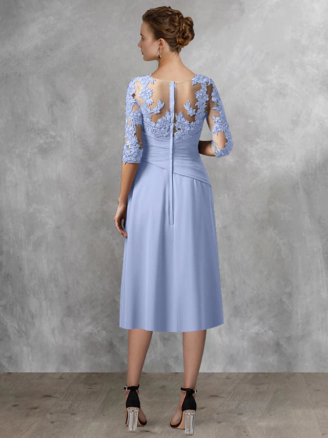 Detail shot of the square neckline and half sleeve of the formal wedding guest dress.