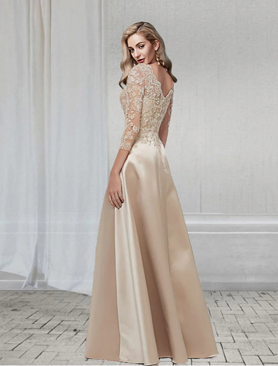 A-line formal dress showing flowing chiffon skirt and applique details.