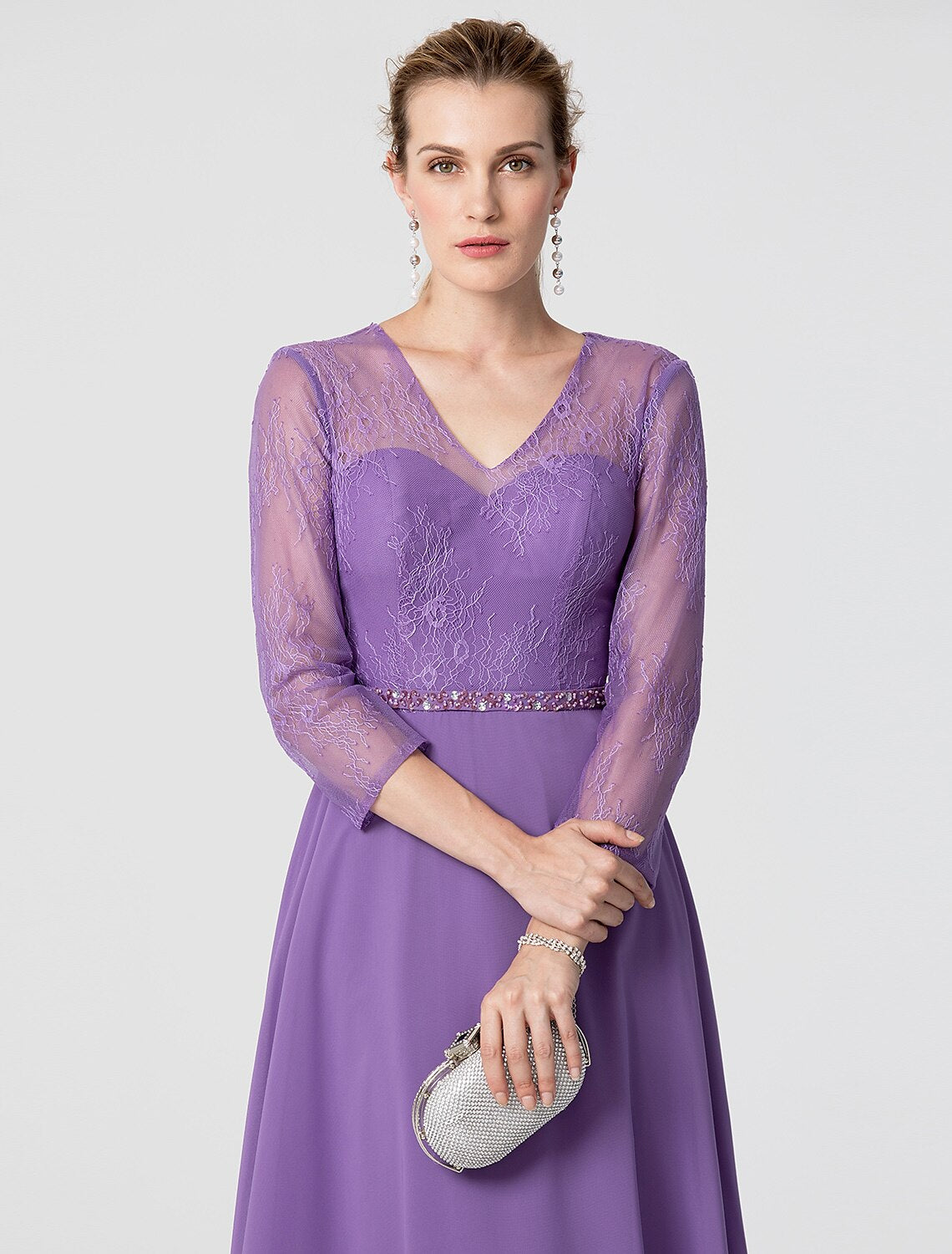 Beaded sash detail on a formal A-line dress.