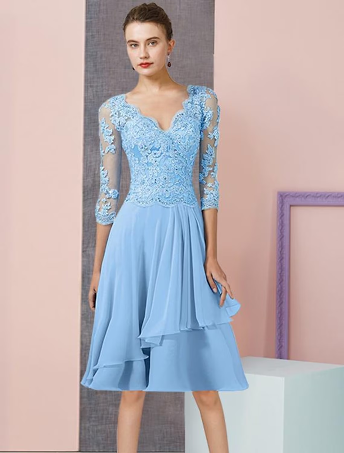 Elegant two-piece A-line mother of the bride dress with V-neck, 3/4 sleeves, and matching wrap.