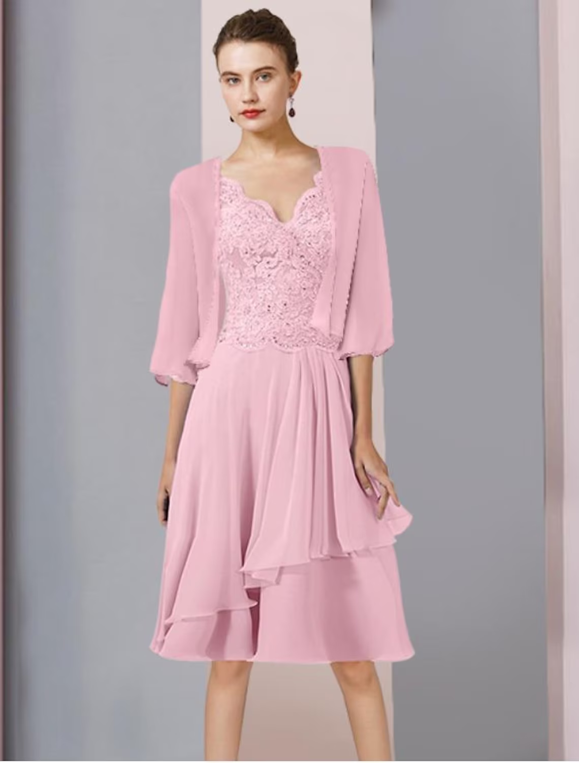 Detail of chiffon lace fabric with delicate beading and sequin embellishments.