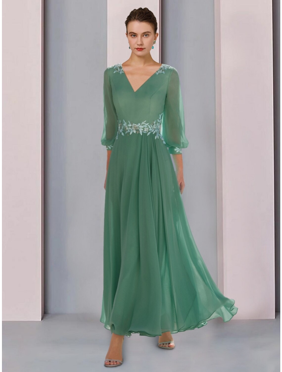 Elegant A-line V-neck Mother of the Bride dress with 3/4 sleeves and lace details.