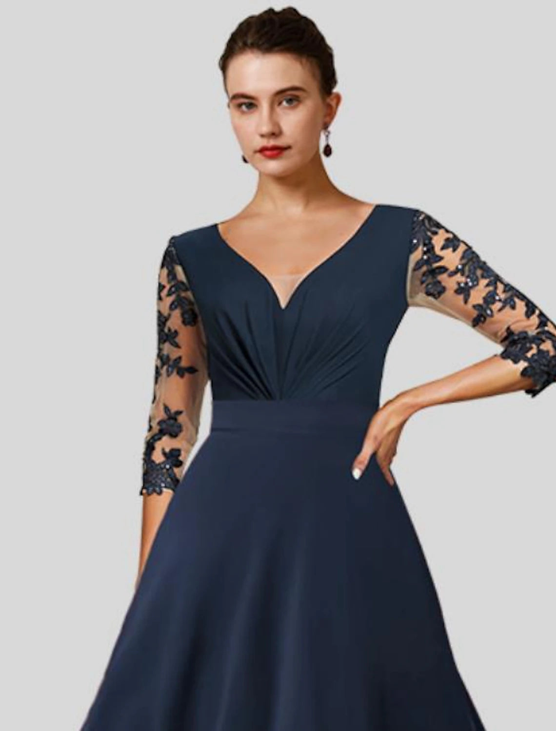 Close-up of the chiffon and lace appliques on the elegant A-Line dress.