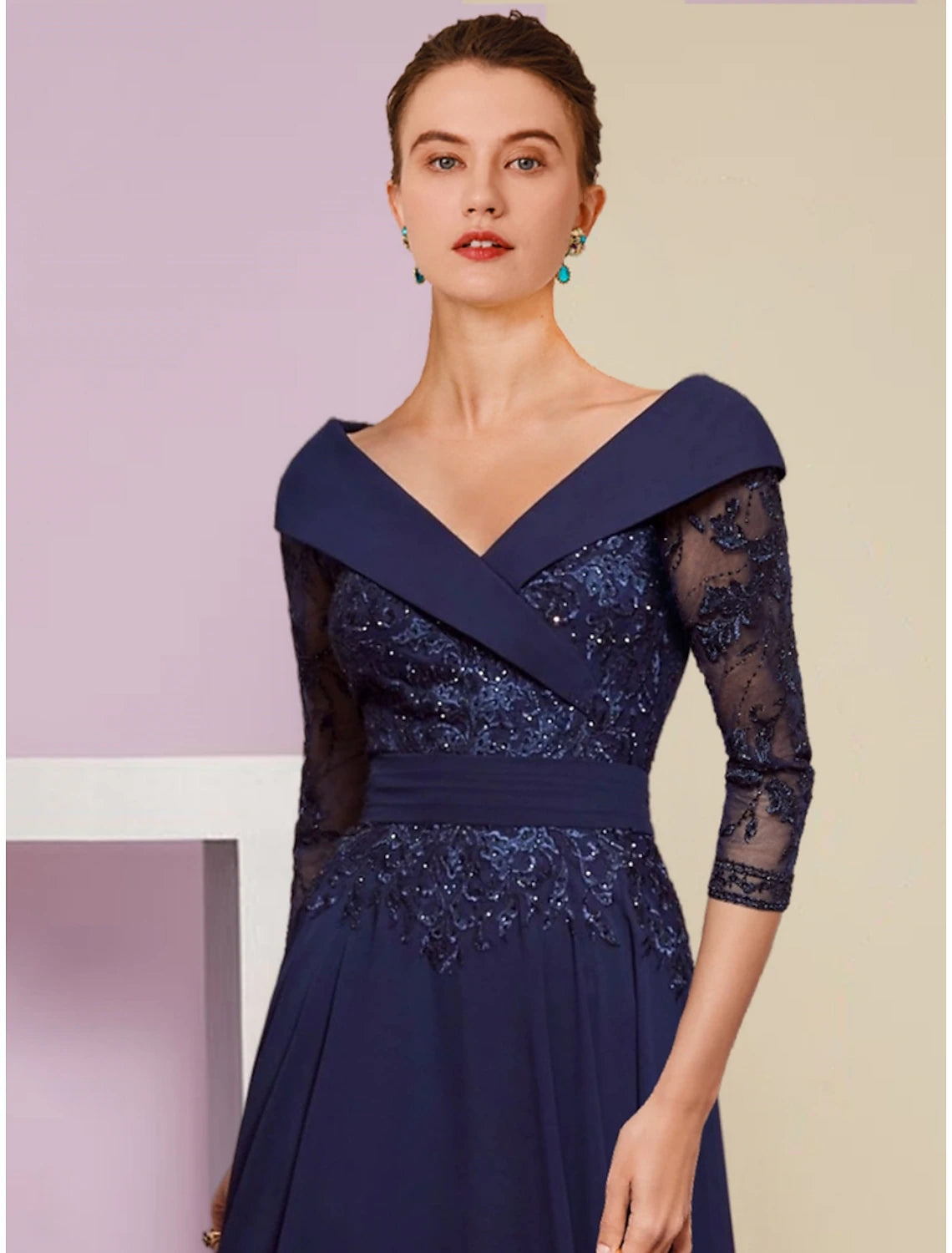 Back view of the elegant A-line V-neck chiffon dress with pleats and sequin accents.
