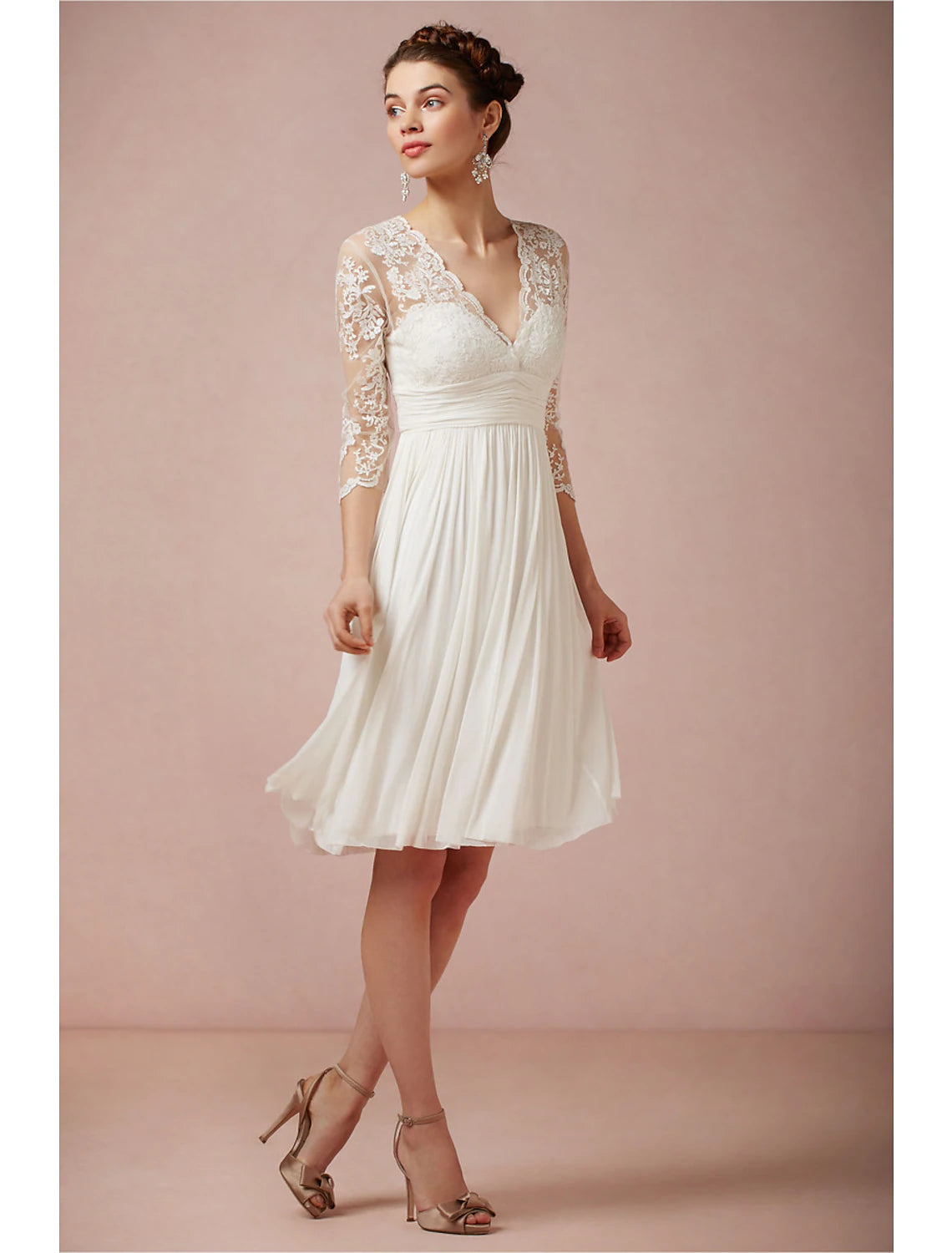 Side view of the knee-length white A-line dress, showing the ruched waist.