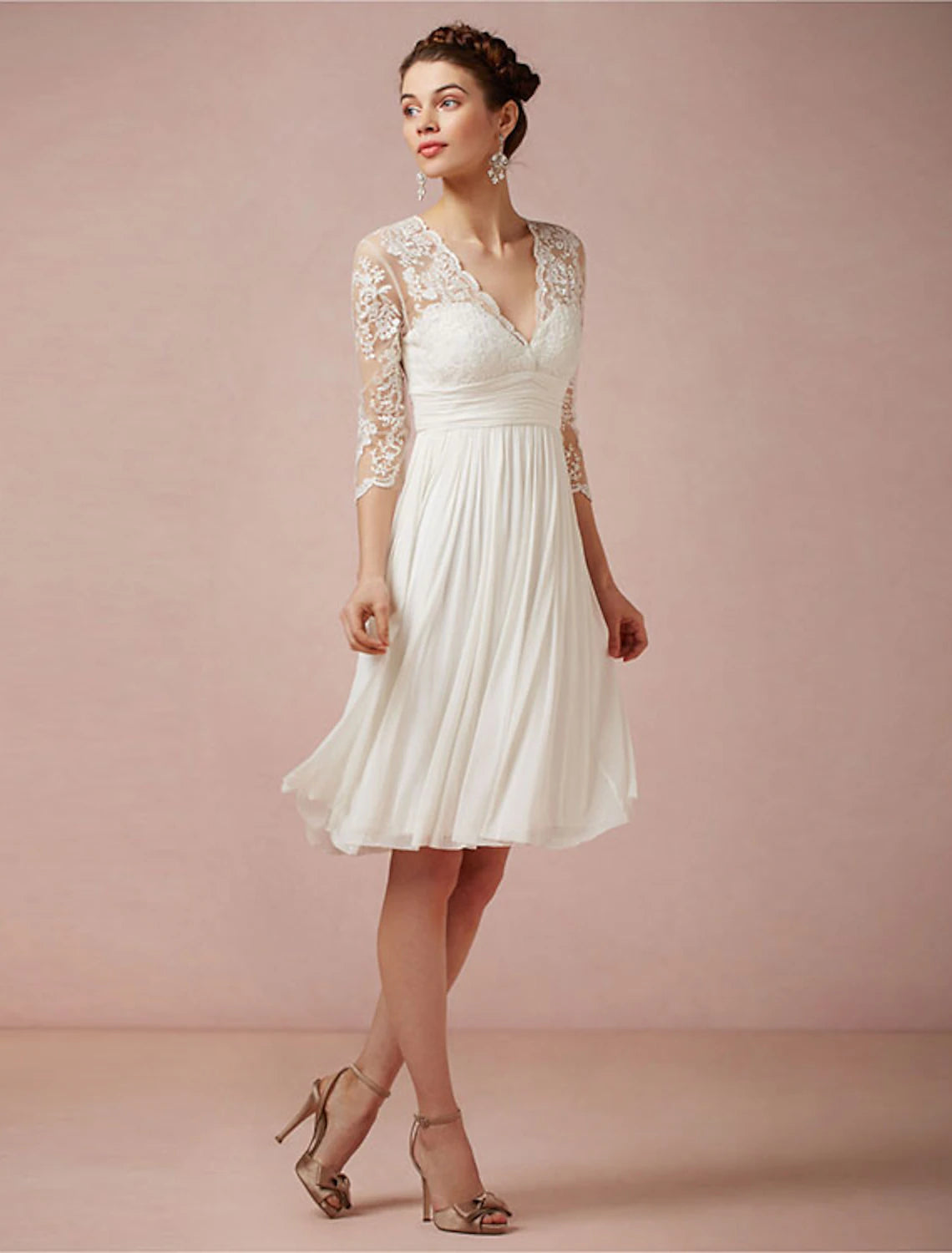 Detail of the chiffon fabric and ruching on the white reception dress.