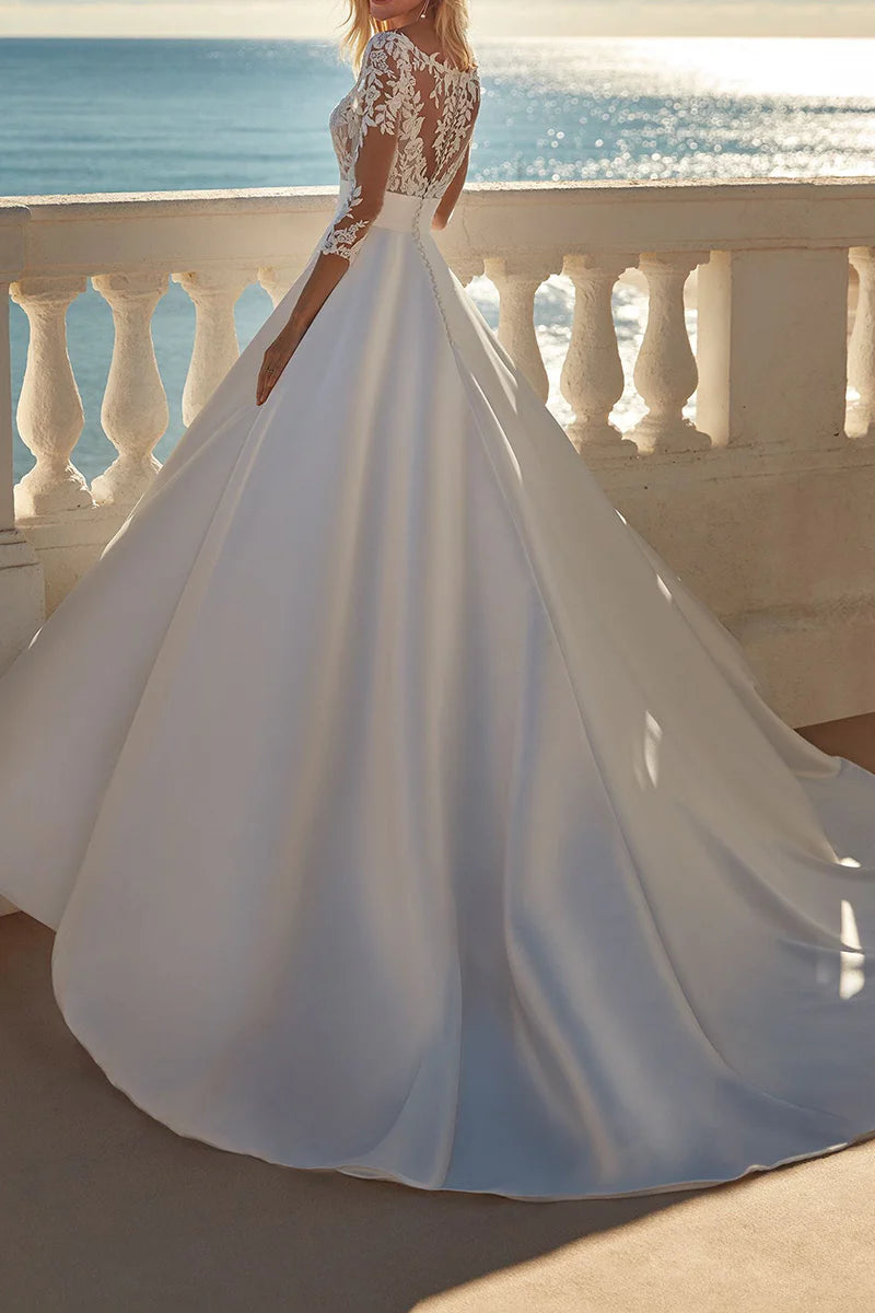 Side view of an A-line V-neck 3/4 sleeve satin wedding dress.