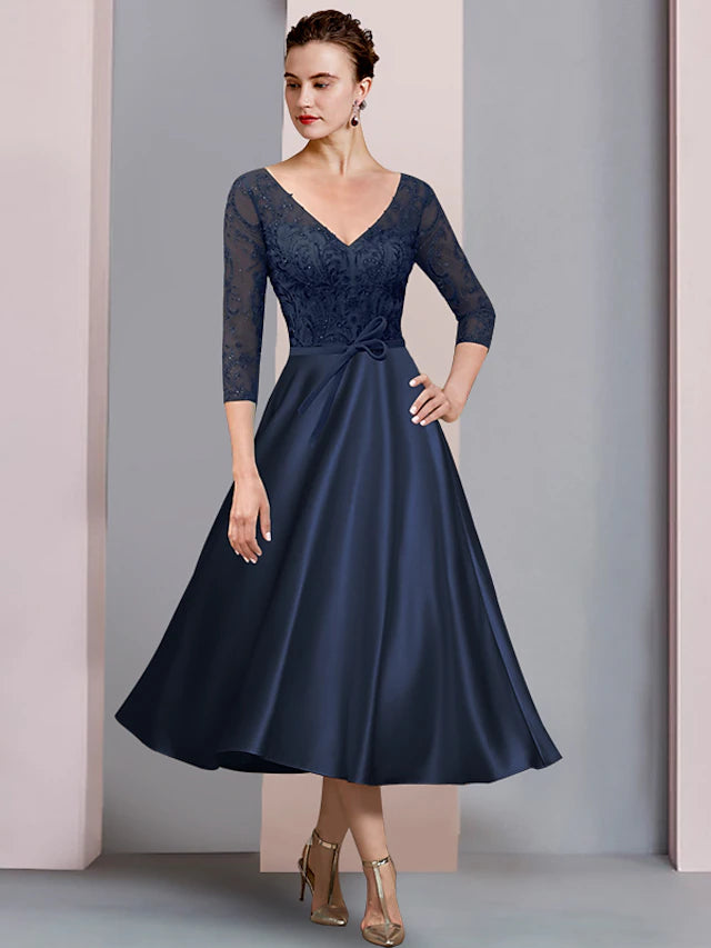 A-Line Mother of the Bride dress with V-neck, 3/4 sleeves, and tea length, featuring satin lace and bow appliques.