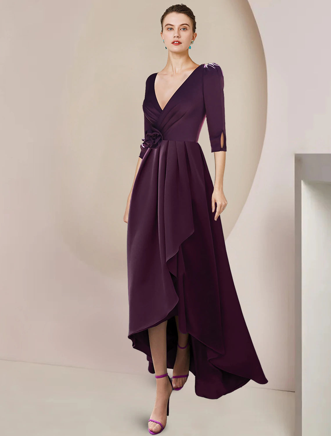 Elegant A-Line Mother of the Bride dress with V-neck, 3/4 sleeves, and high-low tea length hem.