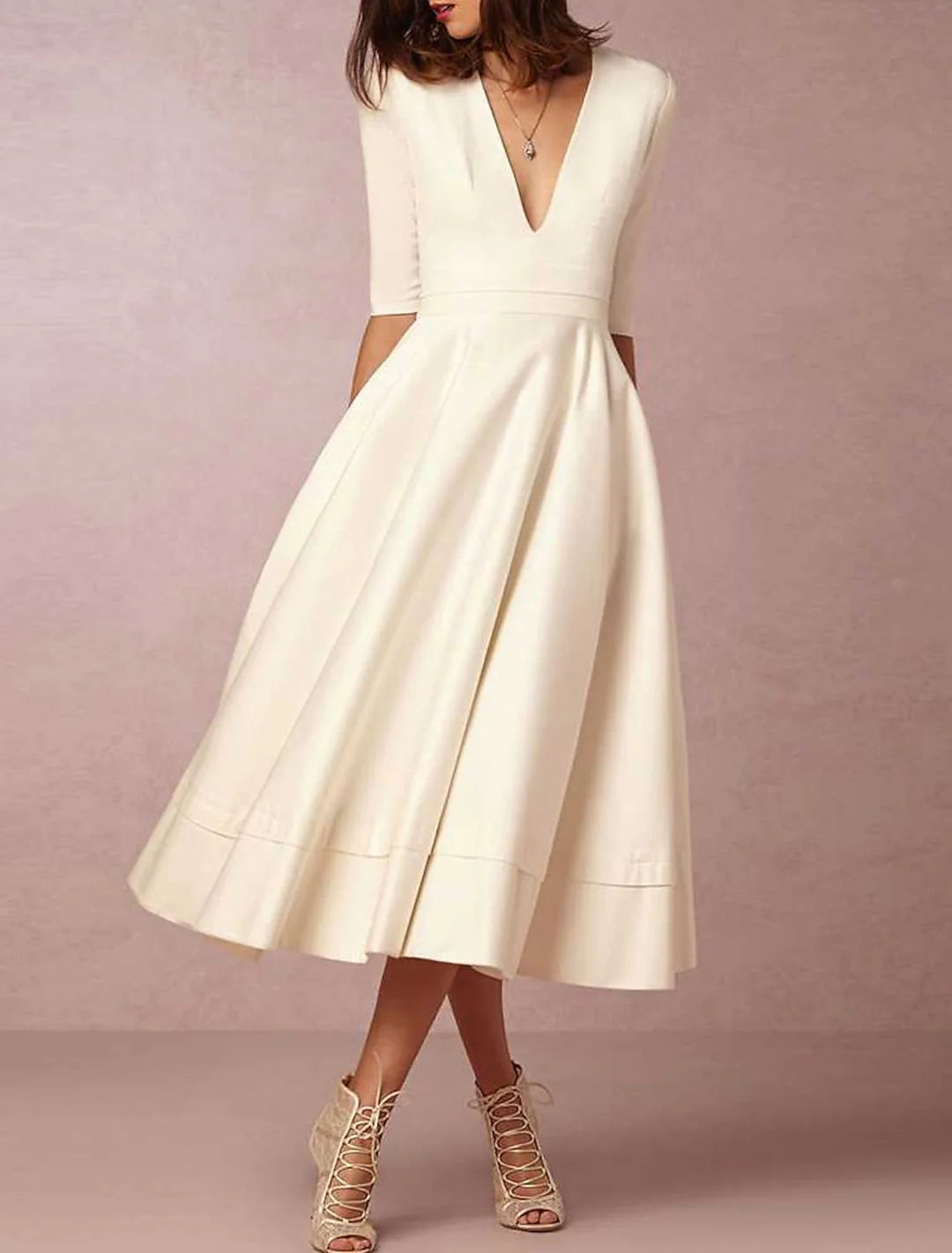 Front view of an A-Line V-Neck ankle-length bridal gown.