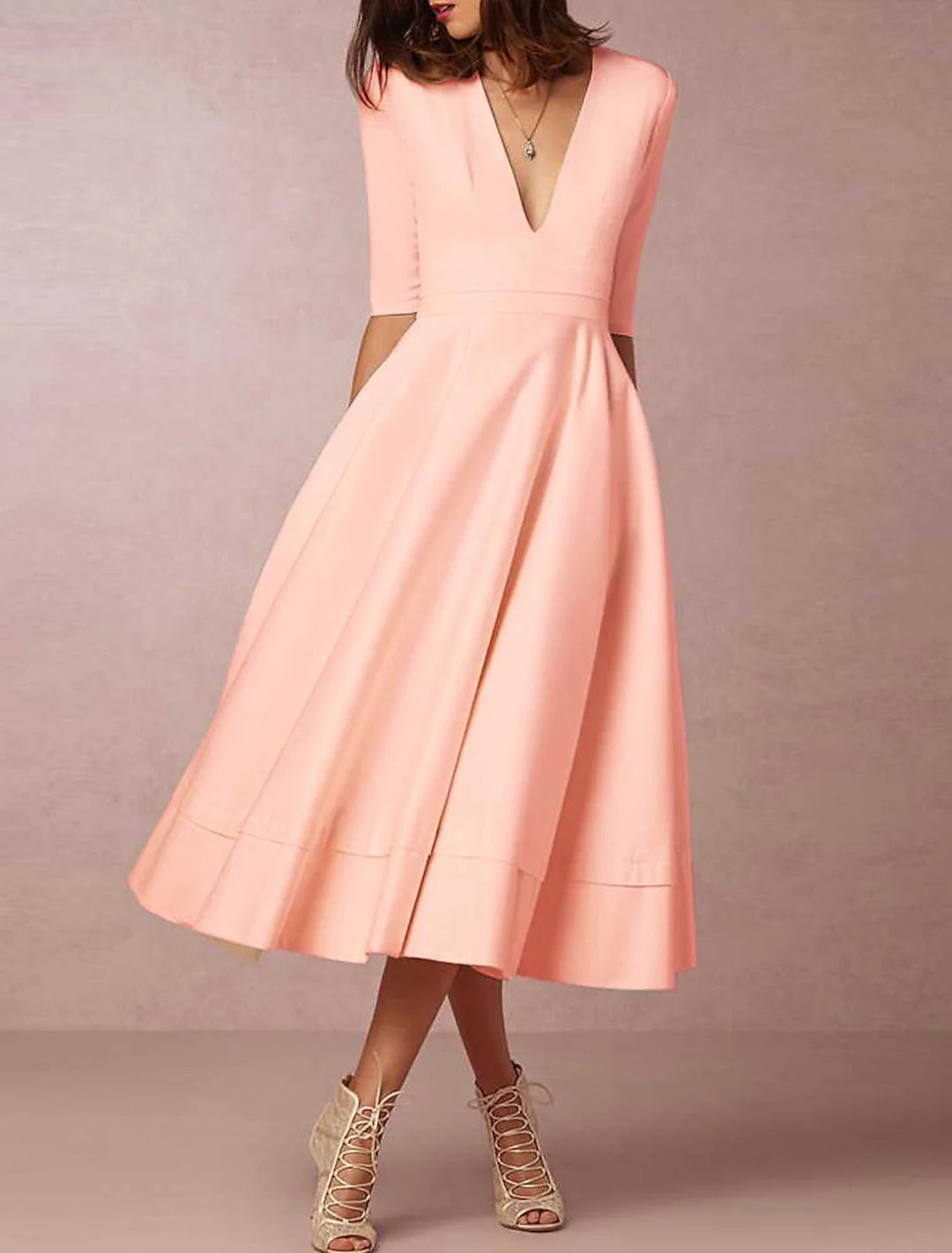 Side profile of an A-Line V-Neck ankle-length wedding dress.