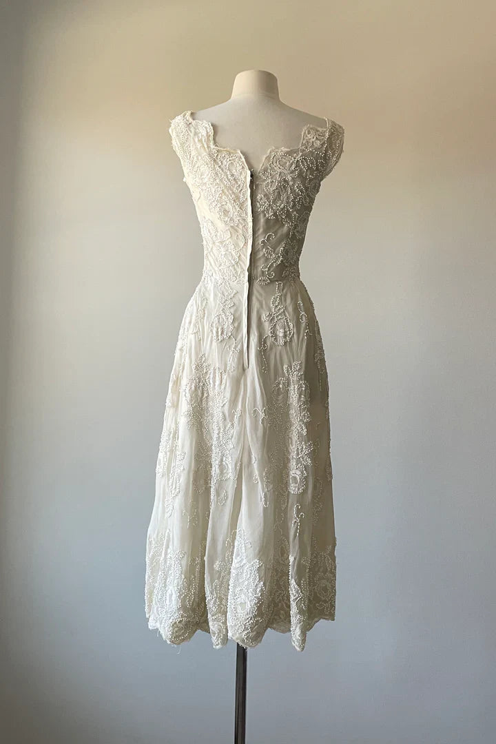 Side view of the A-Line V-Neck tea length prom dress, showcasing its flowing silhouette.