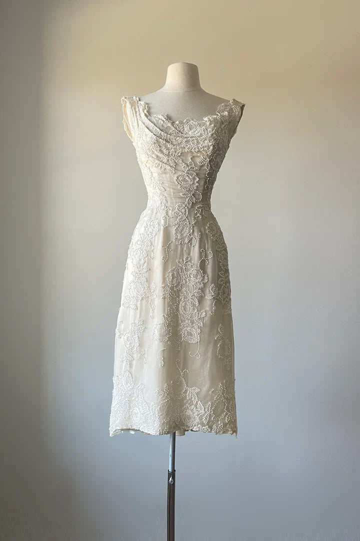 A-Line V-Neck prom dress in satin, featuring delicate beading and a tea length hem.