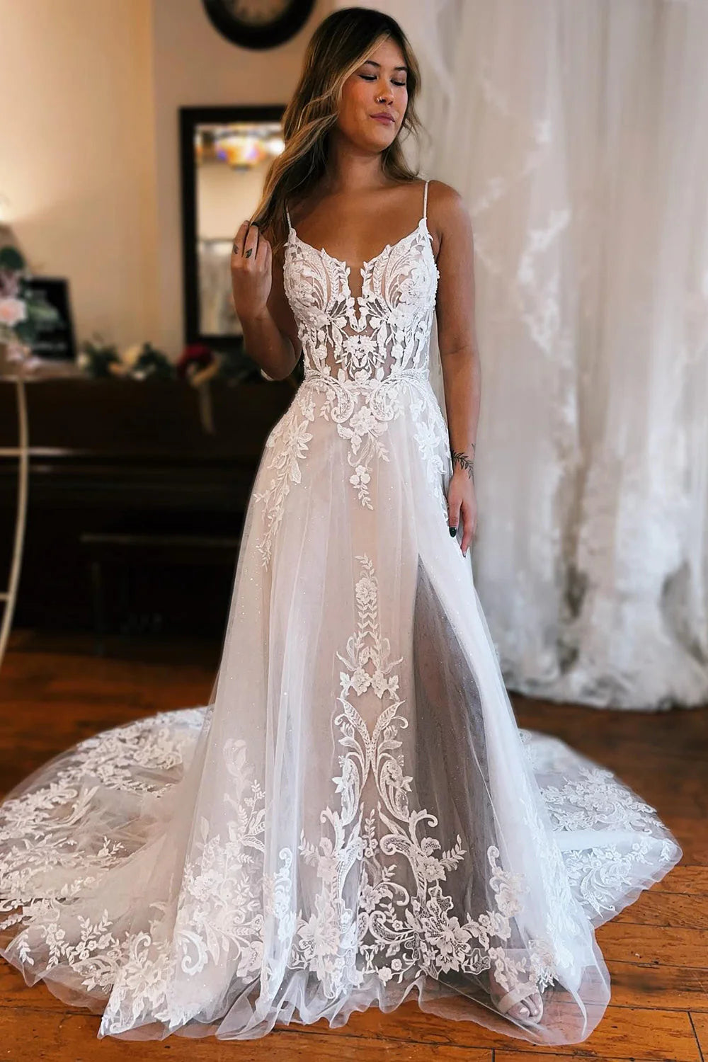 Elegant A-line wedding dress with V-neck and delicate appliques.