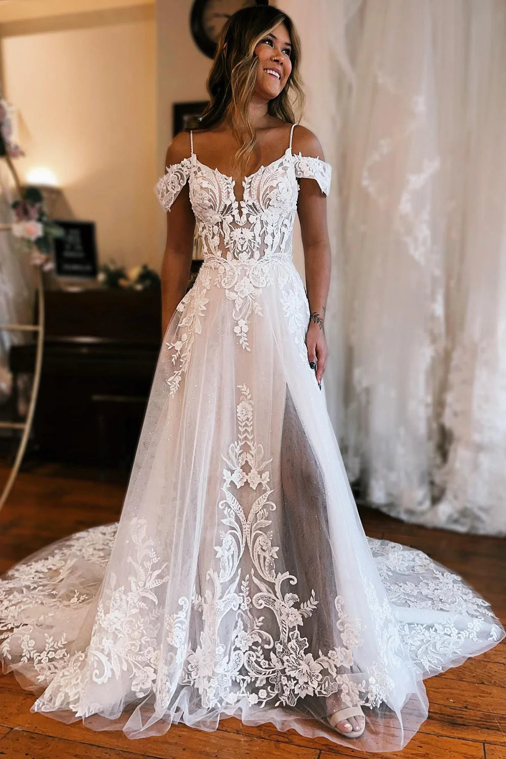 Side view of a bride wearing an A-line wedding dress with appliques.