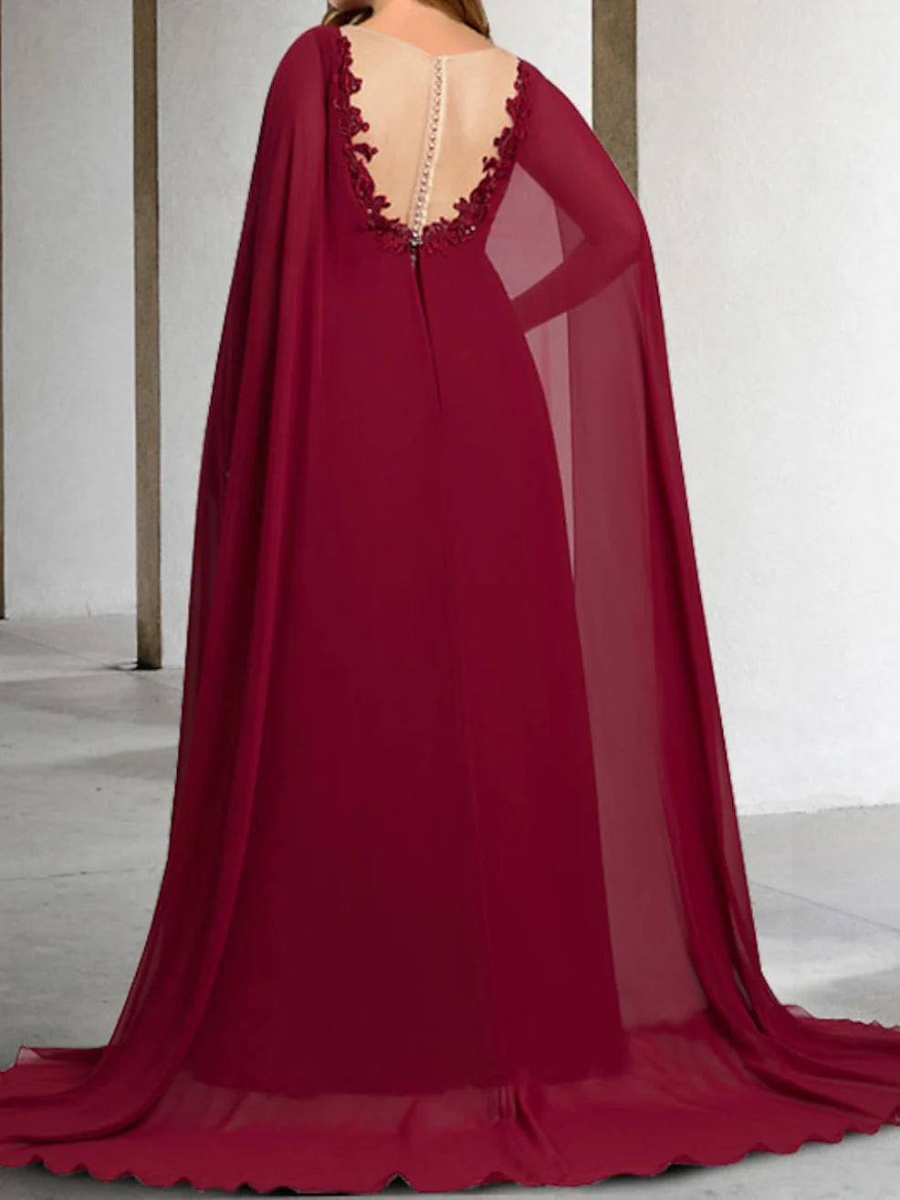 Back view of a formal A-line Mother of the Bride dress featuring intricate applique details.