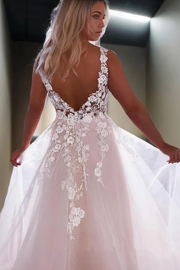 Back view of an A-line V-neck wedding dress featuring lace appliques and a sweep train.