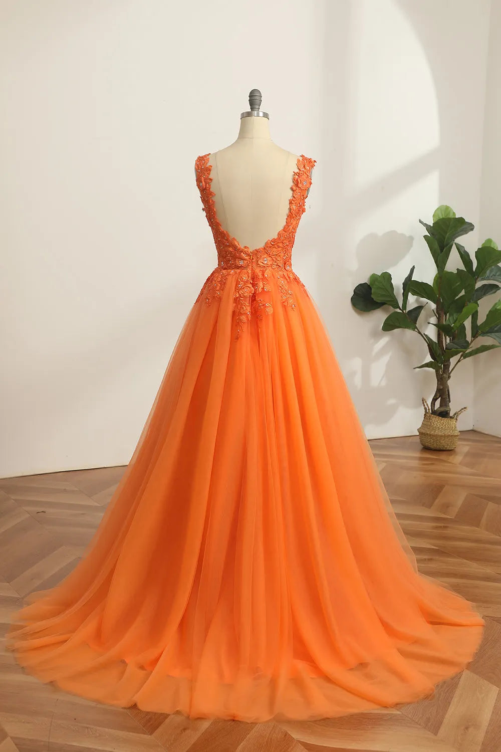 Back view of the A-line V-neck prom dress showing flowing skirt.