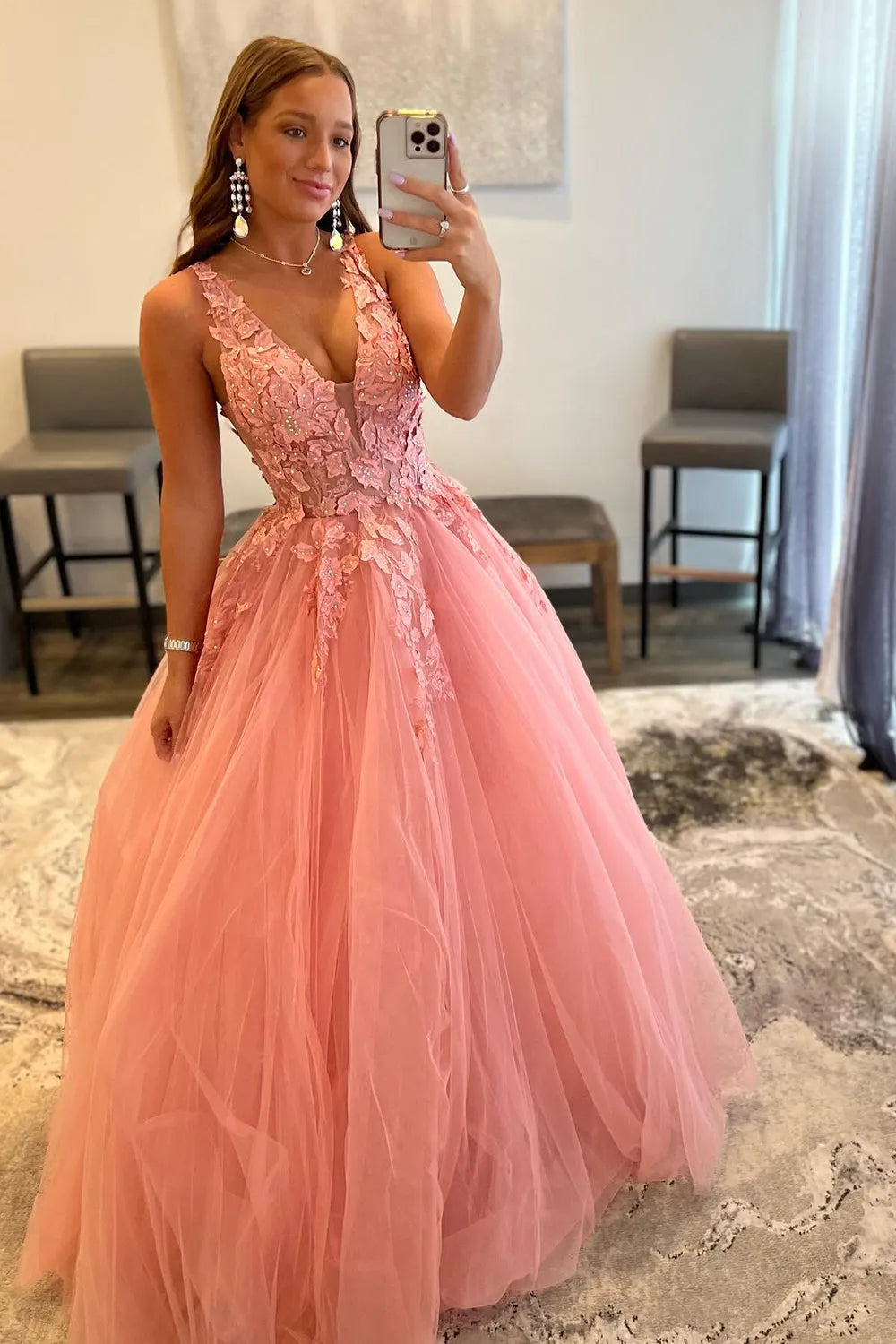 Model wearing the A-line V-neck prom dress, showcasing its silhouette.