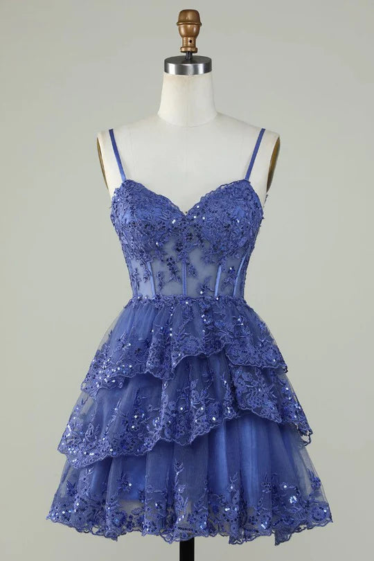 Blue A-Line tulle homecoming dress with applique and straps.