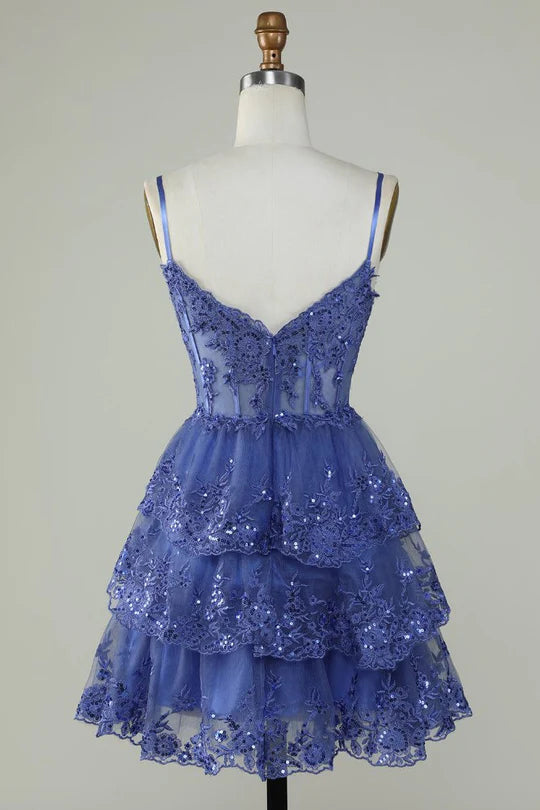 Close-up of blue A-Line tulle dress showing applique details.