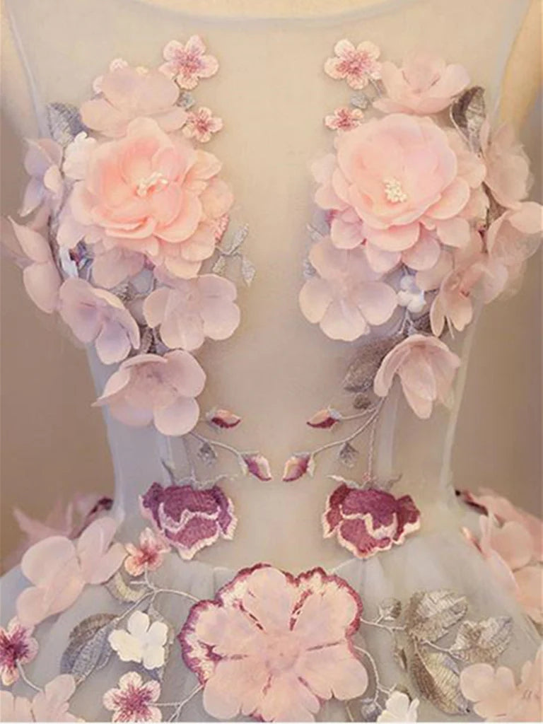 Back view of a sleeveless A-line V-neck short homecoming dress with floral appliques and delicate details.