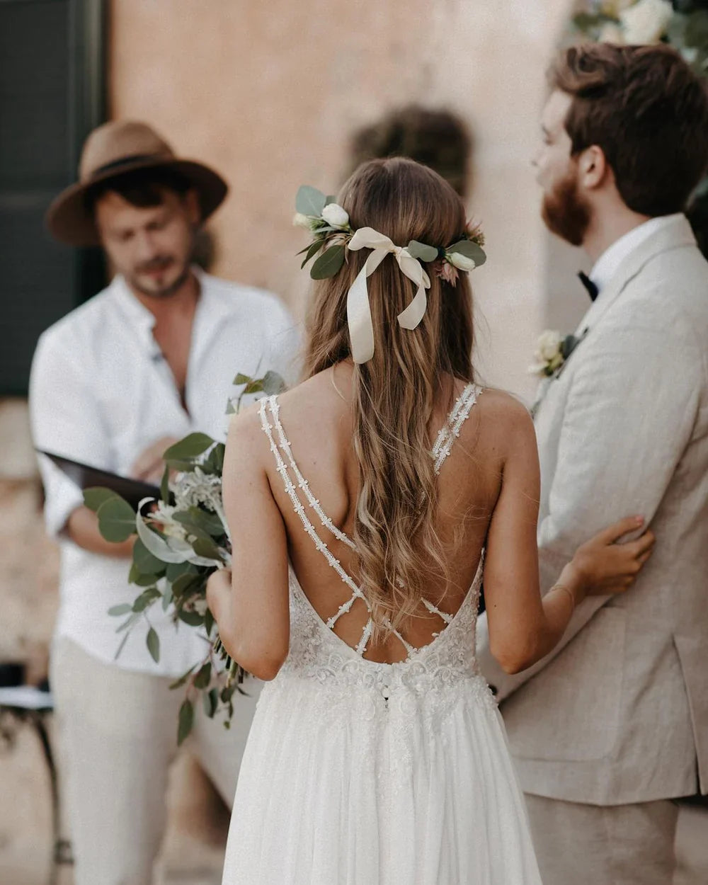 Elegant A-line V-neck chiffon wedding dress with intricate appliques.