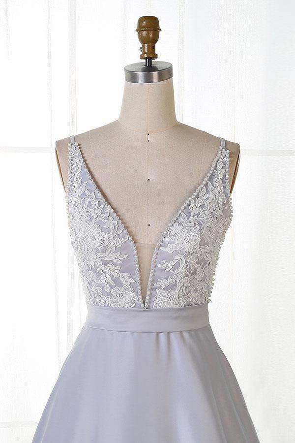 Side view of A-line V-neck satin prom dress.