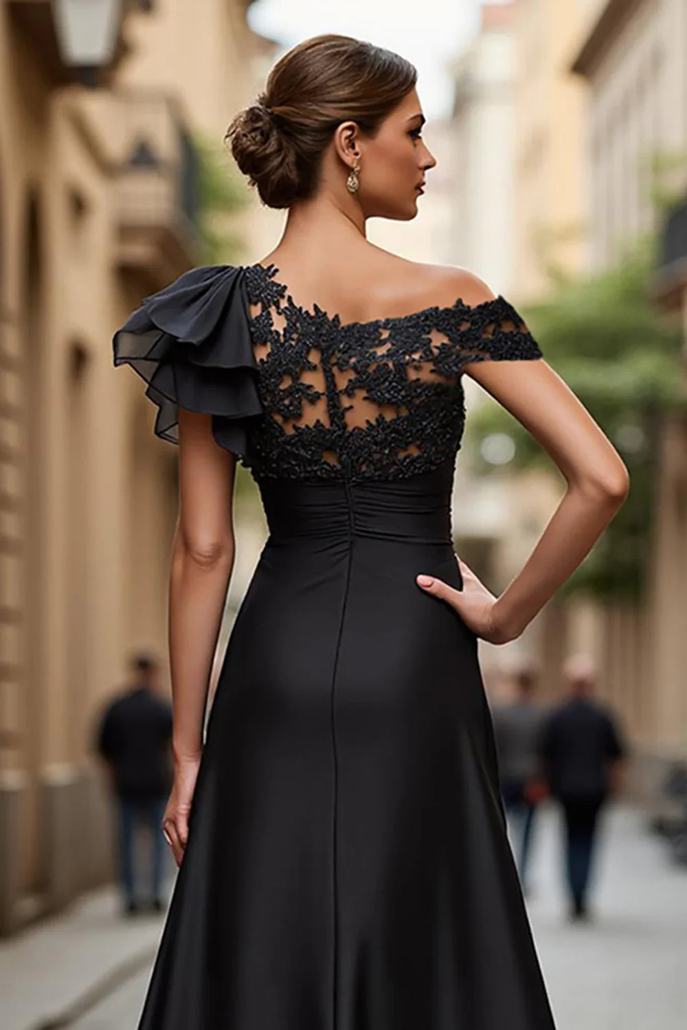 Close-up of appliques on the black A-line prom dress.