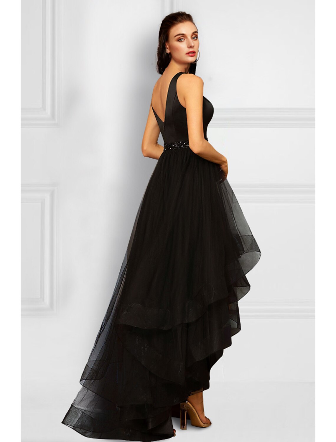 Back view of the asymmetrical sleeveless organza party dress.