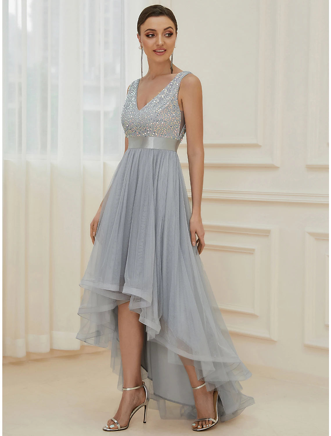 Close-up of sequin and tiered detail on bridesmaid dress.