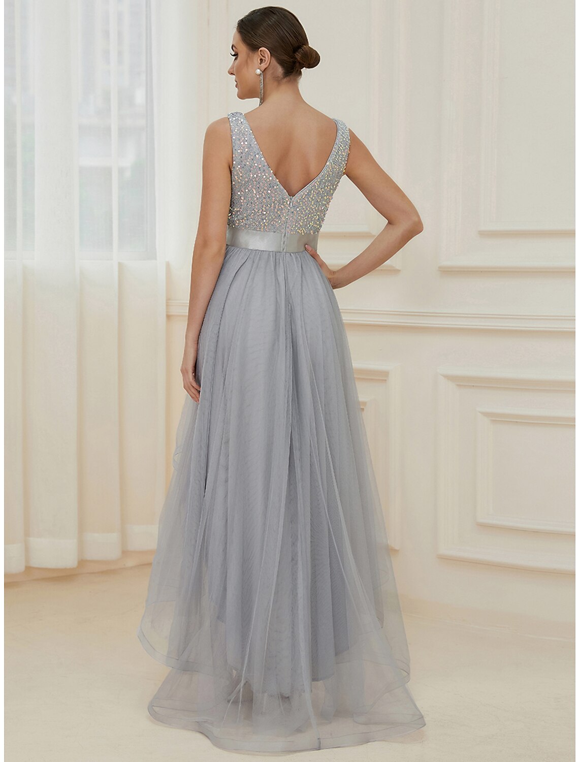 Full view of A-line sequined maxi bridesmaid dress.