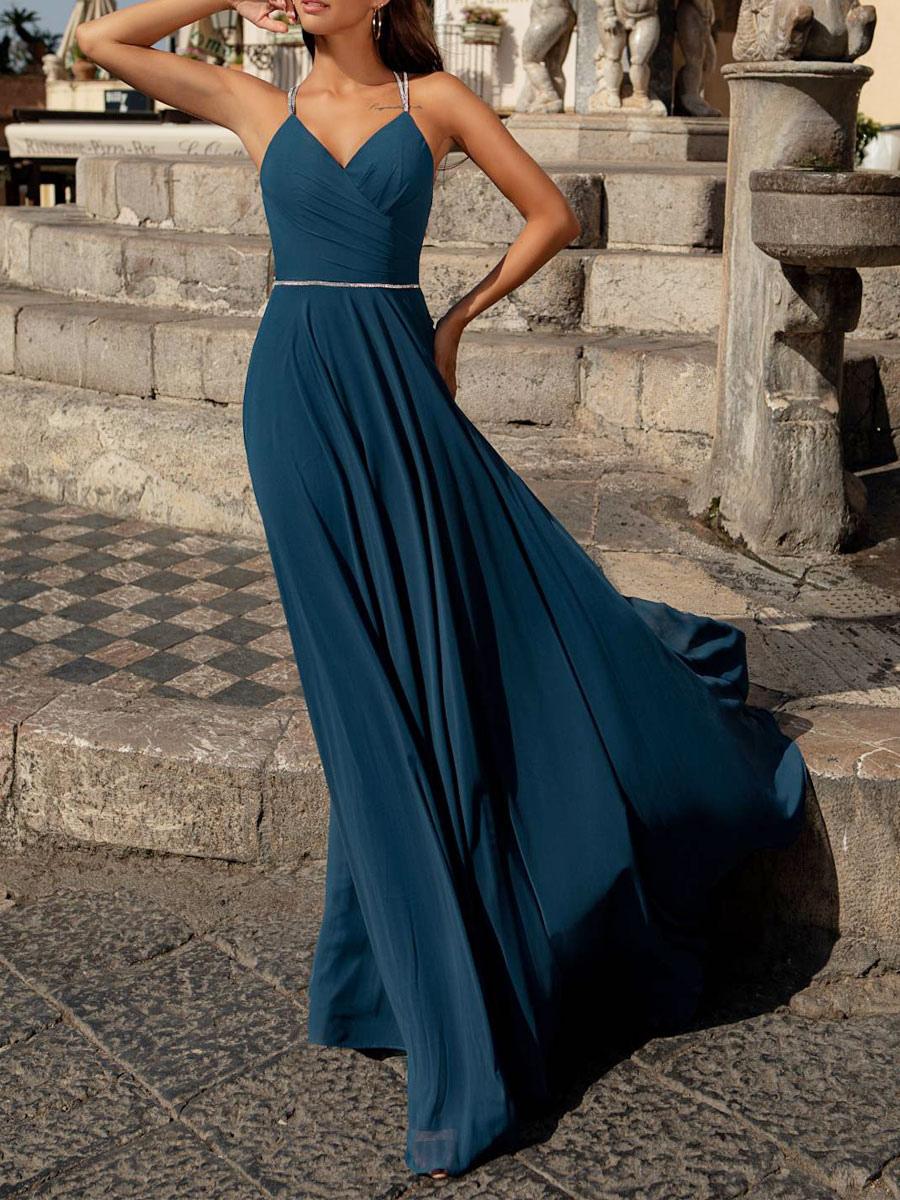 Woman wearing an elegant A-line V-neck floor-length chiffon dress.