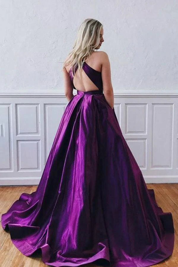 Back view of a purple A-line satin formal dress with crossed straps.
