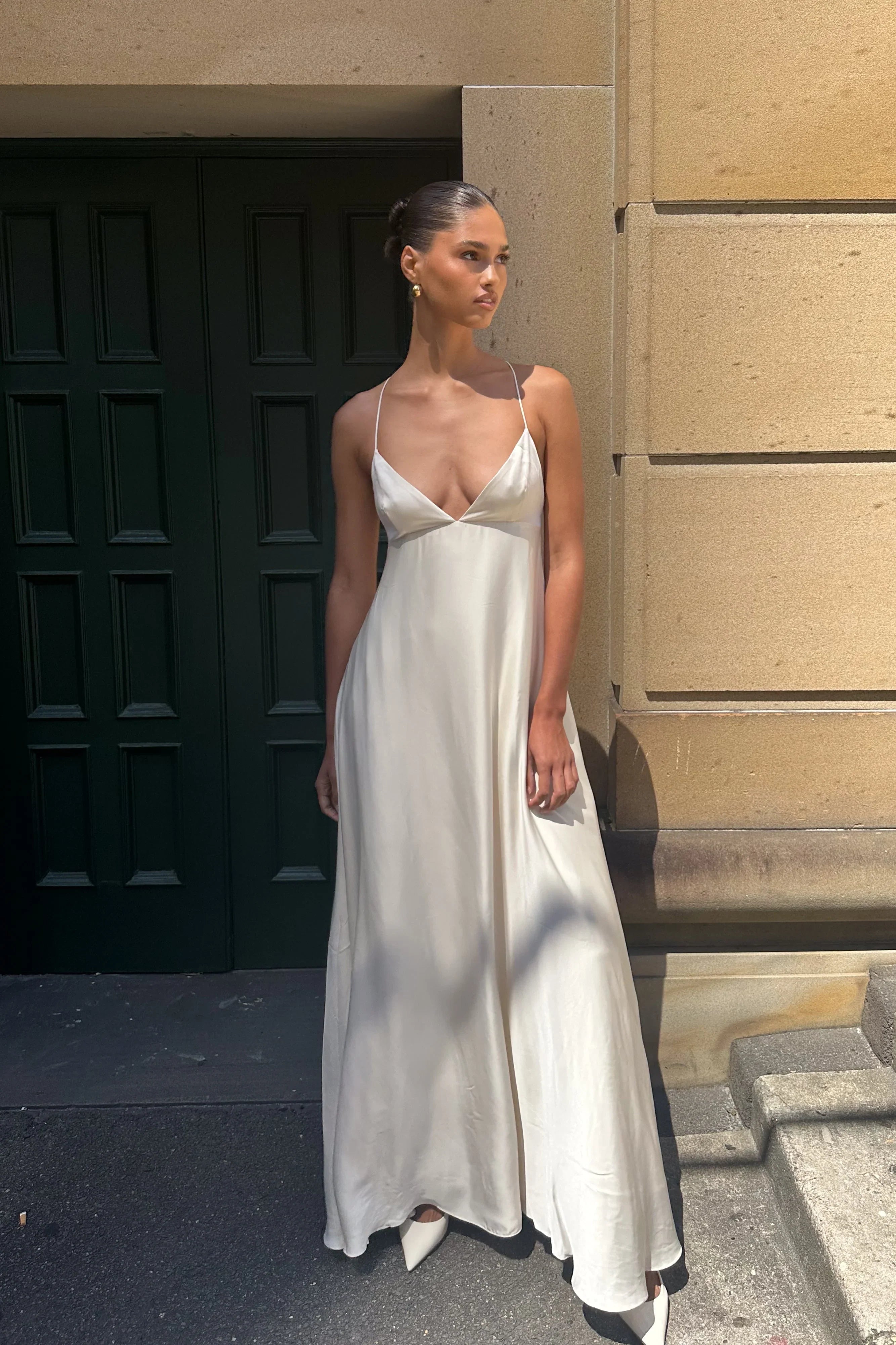 Elegant A-line maxi prom dress with spaghetti straps and V-neckline.