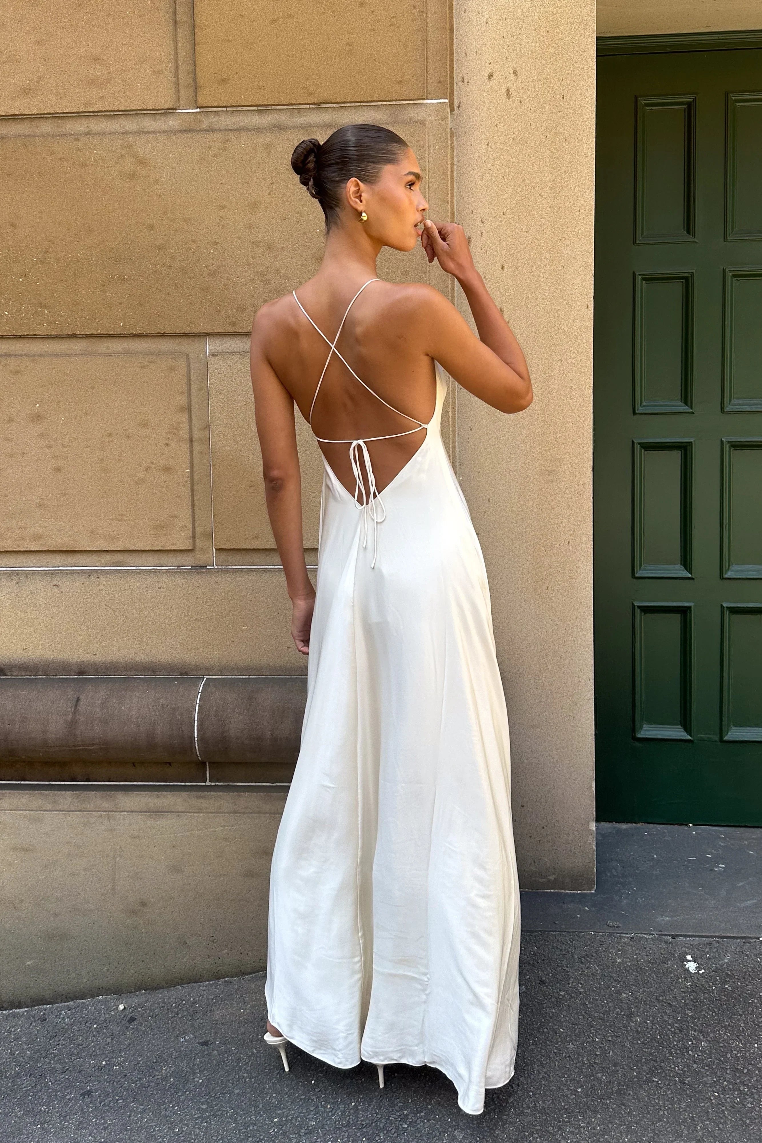 Back view of the A-line maxi prom dress, showcasing the backless design.