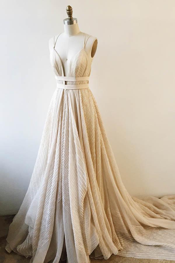 Side profile of the elegant lace prom dress, showcasing its A-line silhouette and V-neck.
