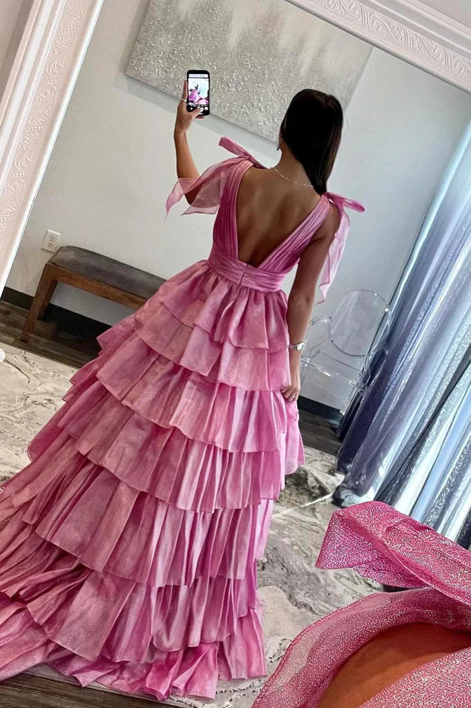 Back view of the long A-line tulle prom dress, showcasing its backless design.