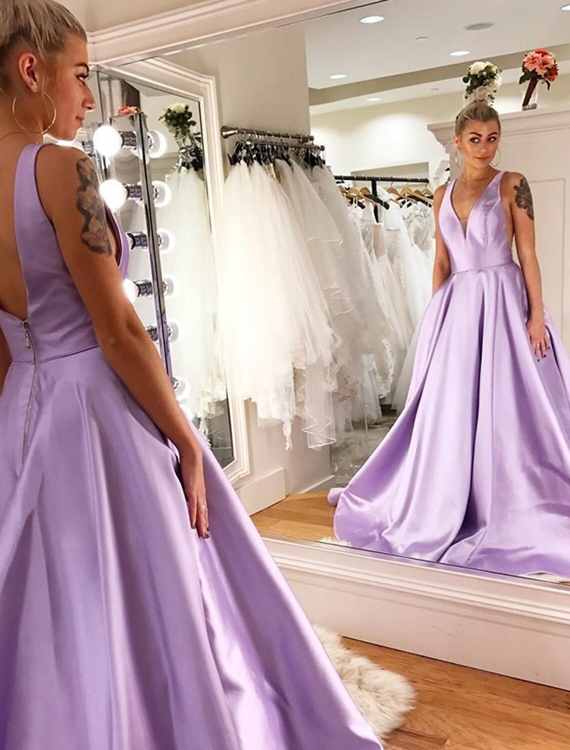 Elegant A-Line V-neck satin prom dress with floor-length skirt and pleated details.