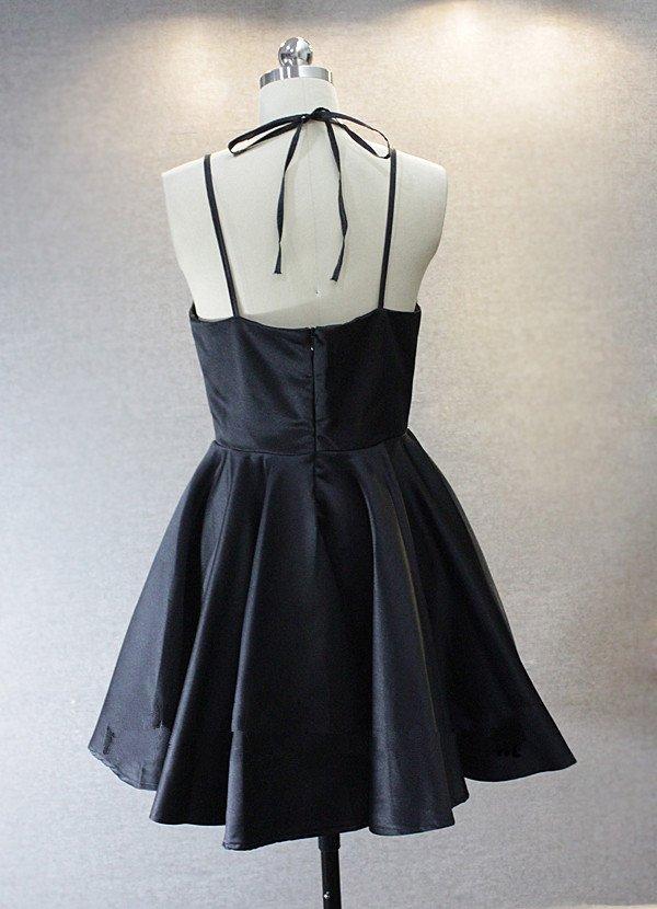 Back view of a woman in a short A-line V-neck homecoming dress.
