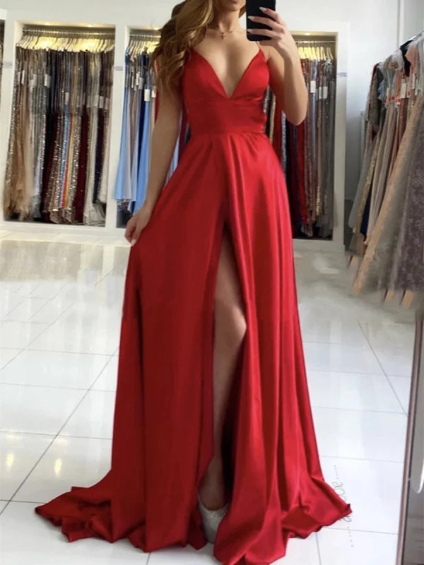Side view of an A-line V-neck backless long prom dress with a flowing skirt.