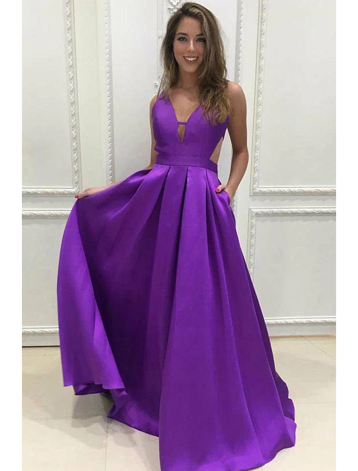 Elegant A-line prom dress in stretch satin with a V-neck and backless design.