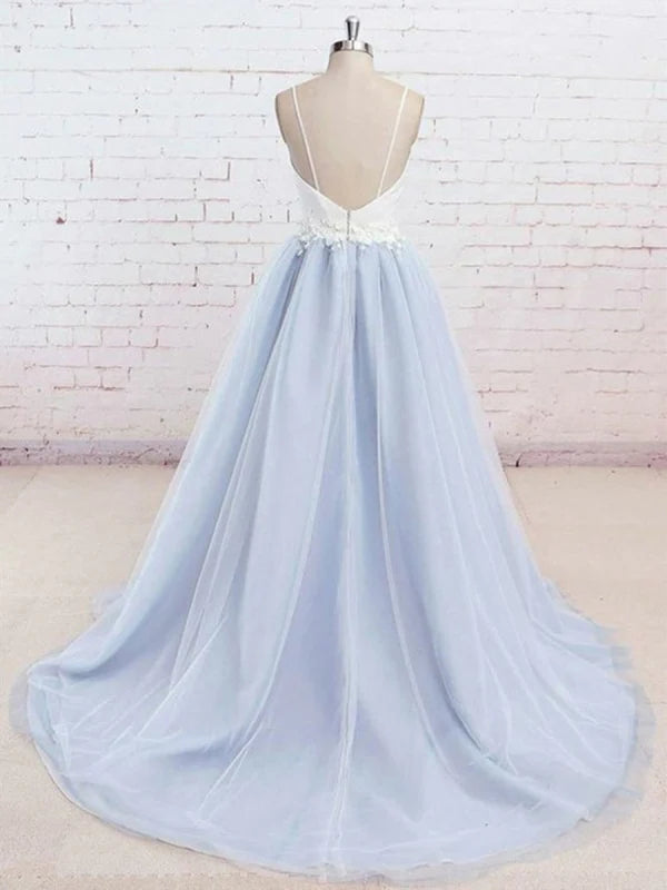 Back view of a V-neck prom dress showing lace appliques on tulle fabric.
