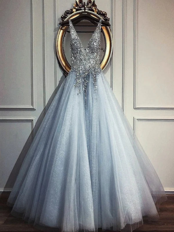 Elegant A-Line V-Neck prom dress with intricate beading and sequins on a tulle skirt.