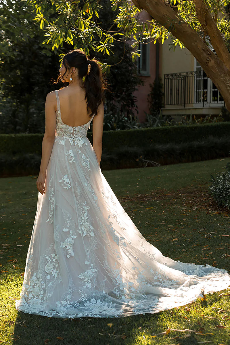 Full view of the romantic A-line V-neck wedding dress.