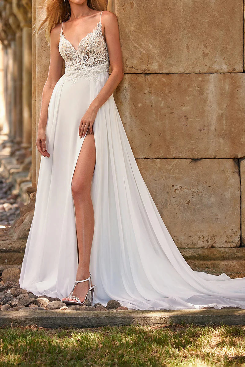 Full view of A-line boho wedding dress with V-neck, lace appliques, and a front slit.