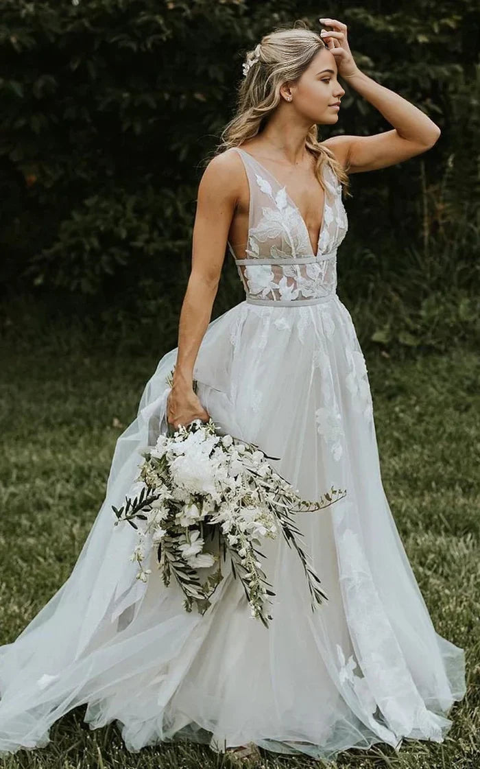 A-Line boho lace V-neck tulle wedding dress with appliques.
