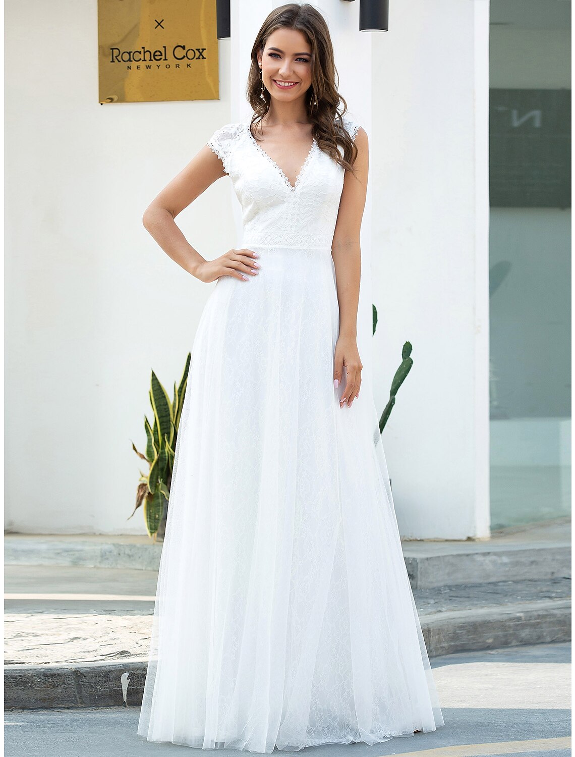 A-line V-neck cap sleeve lace beach wedding dress.